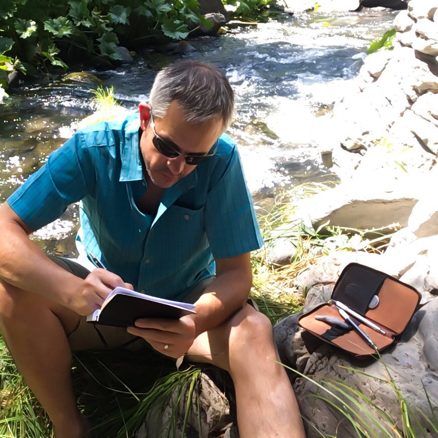 LP1 2 Man Sketching in the Sierra Nevada's Man sketching by a river in the mountains